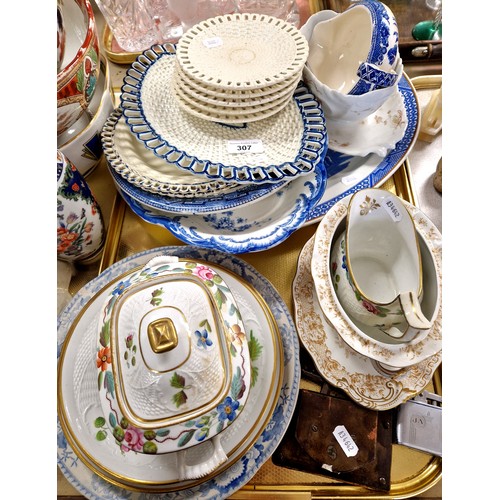 307 - A 19th century twin handled sauce tureen, similar plates also a collection of blue and white.