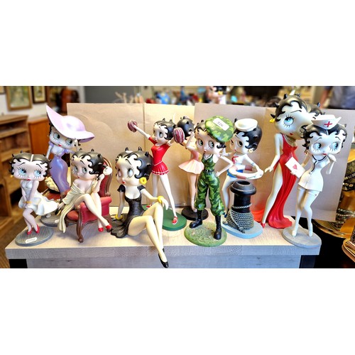 326 - Collection of ten Betty Boop figurines to include a soldier, cheerleader, dog walker, ballerina, etc... 