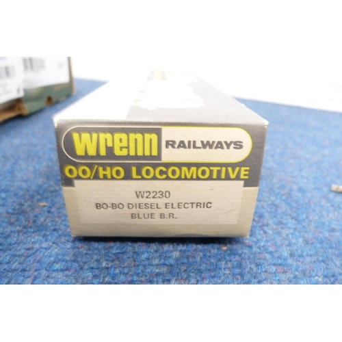 11 - Two cartons containing 00 gauge parts to include coaches, bogeys, loco parts, wheels, boxed Wrenn Ra... 