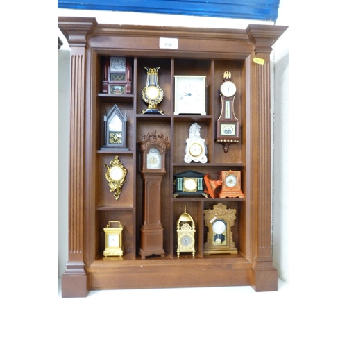 156 - Collection of modern Franklin Mint miniature timepieces to include a skeleton clock in domed case, c... 