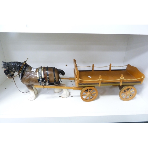 159 - Ceramic model of a heavy horse with harness pulling a cart.