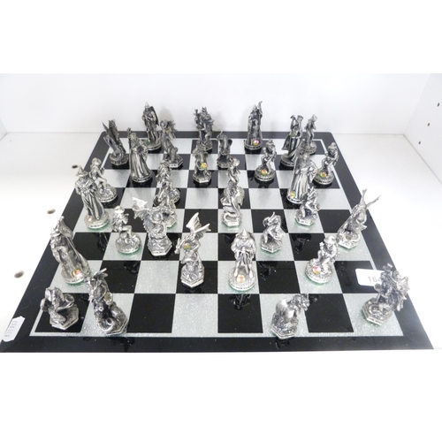 164 - Tudor Mint Wizards and Dragons chess set with board, 2002 (one shelf).