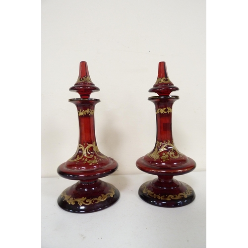 175 - Glassware to include antique ruby-coloured glass bottles and stoppers, similar Bohemian-style vase, ... 