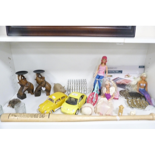 181 - Barbie dolls, 'The Slugger' baseball bat and ball, Burago model cars, toast rack, pair of elephant o... 