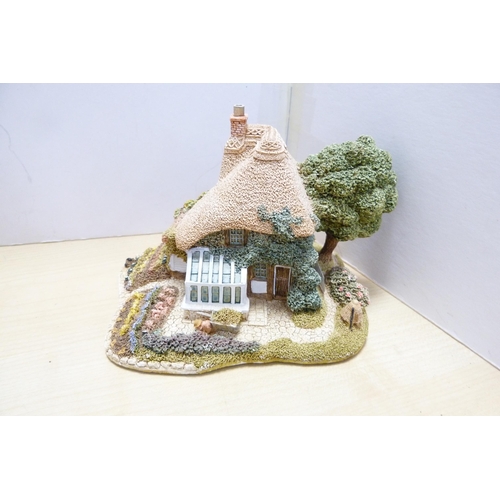 196 - Group of model thatched cottages and buildings, to include examples by Lilliput Lane. (9)