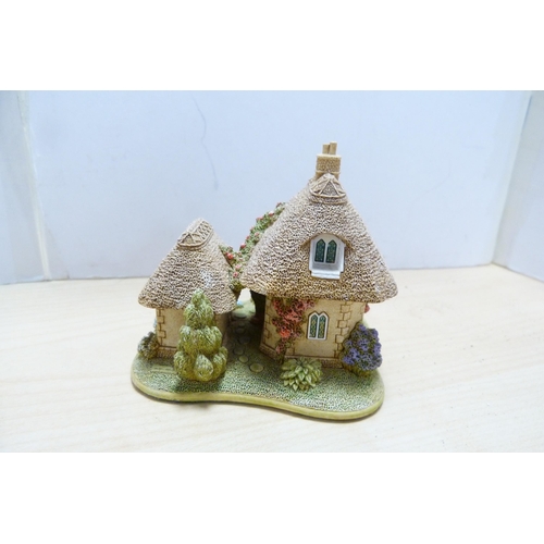 196 - Group of model thatched cottages and buildings, to include examples by Lilliput Lane. (9)