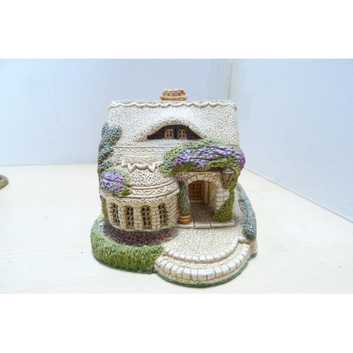 196 - Group of model thatched cottages and buildings, to include examples by Lilliput Lane. (9)