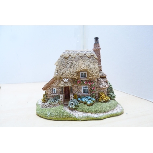 196 - Group of model thatched cottages and buildings, to include examples by Lilliput Lane. (9)