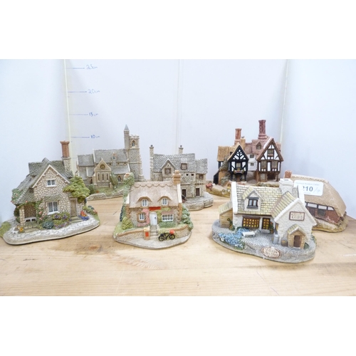 210 - Group of model thatched cottages and buildings, mostly by Lilliput Lane.  (7)