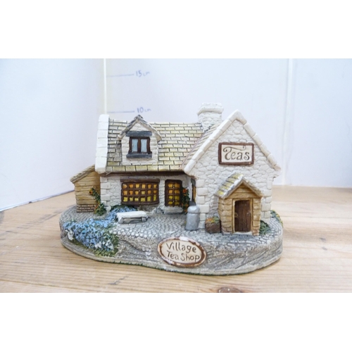 210 - Group of model thatched cottages and buildings, mostly by Lilliput Lane.  (7)