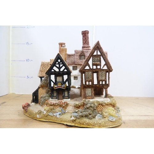 210 - Group of model thatched cottages and buildings, mostly by Lilliput Lane.  (7)