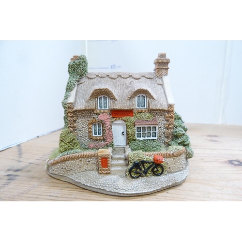 210 - Group of model thatched cottages and buildings, mostly by Lilliput Lane.  (7)