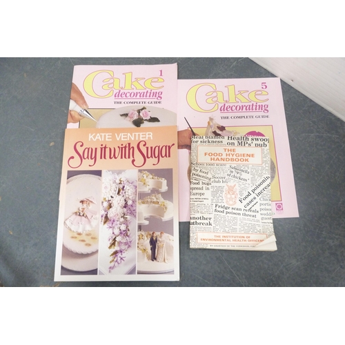 216 - Collection of sugar craft items to include books, nozzles, cutters, boards etc.