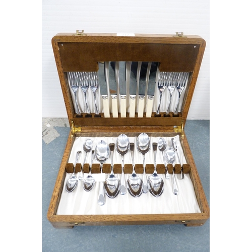 217 - Group of boxed part canteens of cutlery and a boxed part carving set.