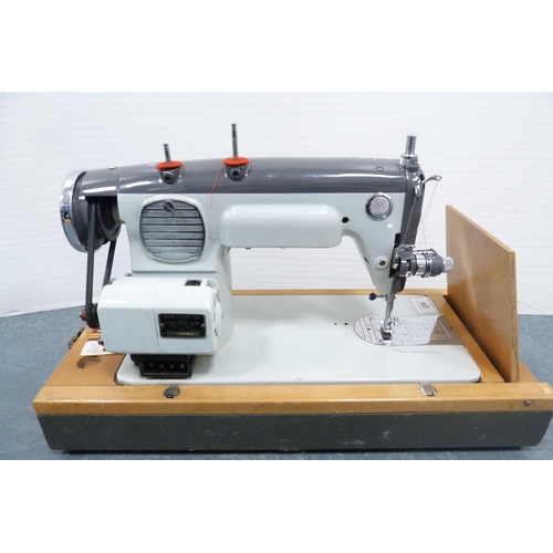 230 - Sew-Tric Novum sewing machine in fitted case.