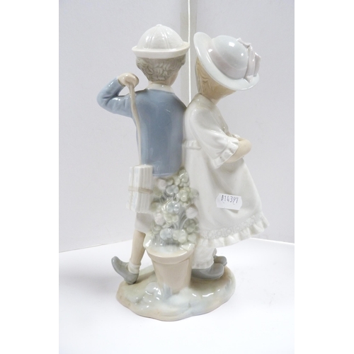 237 - Lladro figure group modelled as a boy and girl couple, and two Lladro child angel figures, one playi... 