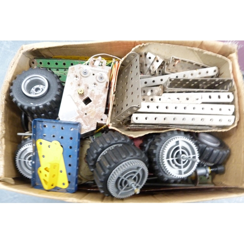 25 - Three cartons containing loose Meccano accessories to include cogs, wheels, plates etc.