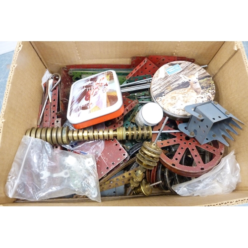 25 - Three cartons containing loose Meccano accessories to include cogs, wheels, plates etc.