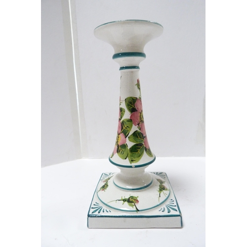 253 - Wemyss Ware candlestick decorated with roses, c. 1900, on square base (a/f).