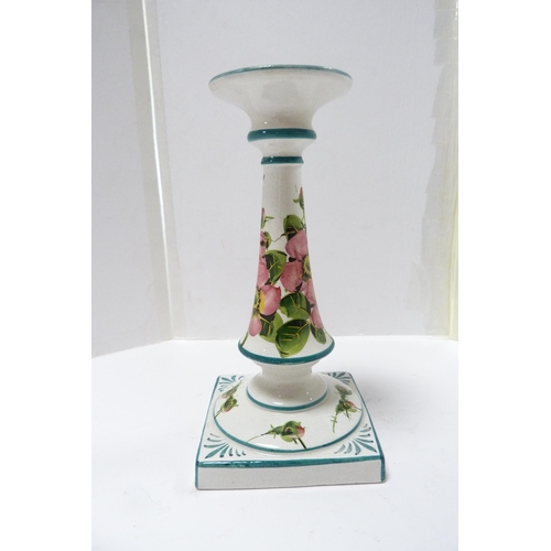 253 - Wemyss Ware candlestick decorated with roses, c. 1900, on square base (a/f).