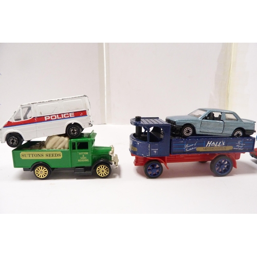 261 - Group of model diecast vehicles, mainly Lledo vans, and a few older examples, London bus, police van... 