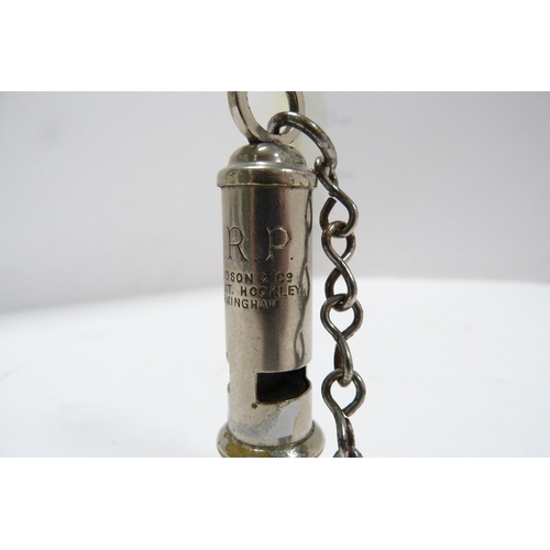 263 - Acme Boy Scout's whistle and an ARP whistle on chain by Hudson & Co., Birmingham.