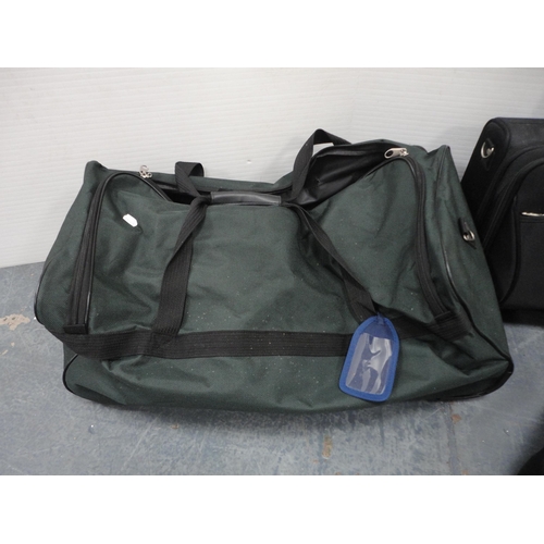 273 - Two holdalls and a travel case.