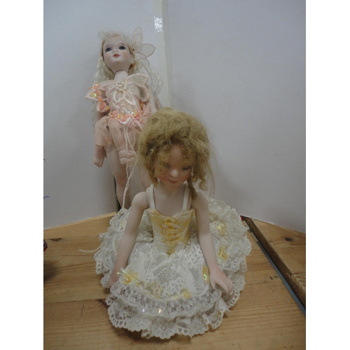 274 - Four bisque china dolls, in assorted dress.  (4)