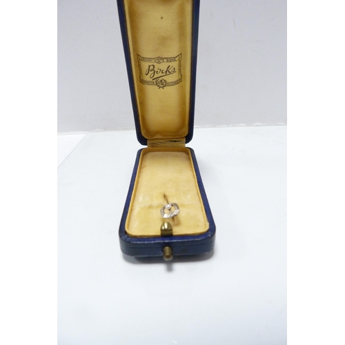 282 - 14k white gold stick pin, the yellow metal pin unmarked, set with a seed pearl, in fitted case.