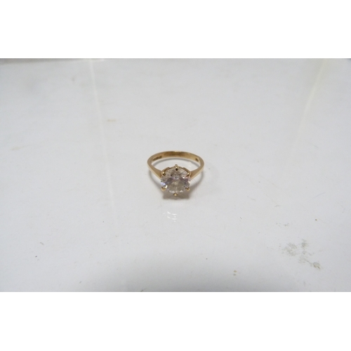 285 - 9ct gold lady's solitaire ring set with a faux gemstone, 3g gross.