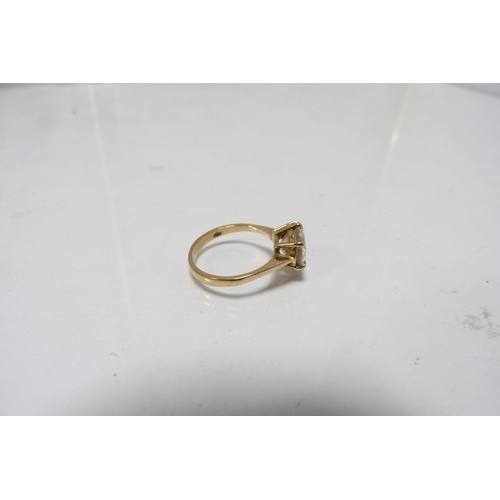 285 - 9ct gold lady's solitaire ring set with a faux gemstone, 3g gross.