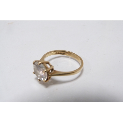 285 - 9ct gold lady's solitaire ring set with a faux gemstone, 3g gross.