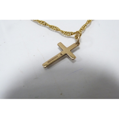 288 - 9ct gold cross pendant attached to a yellow metal chain, two other 9ct gold pendants, gold weight ap... 