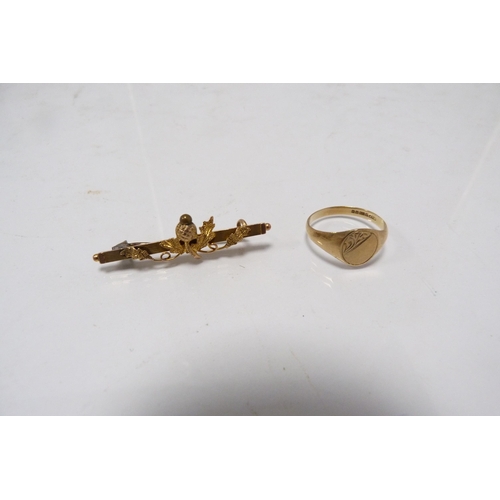 292 - 9ct gold ring and a 9ct gold thistle decorated brooch, 3.5g gross.  (2)