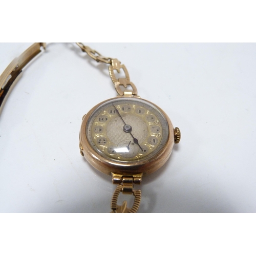 296 - Antique 9ct gold-backed lady's wristwatch, on rolled gold strap, 17.3g gross.