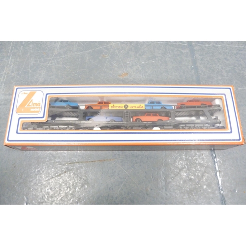 30 - Carton containing boxed Lima coaches to include 5329, 9053, loose BR examples, Tri-ang and Hornby 00... 