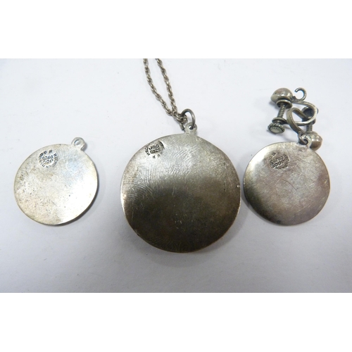 302 - Three Mexican 925 silver Aztek pendants, graduated sizes, approximately 12g gross, a Mexican coin-mo... 