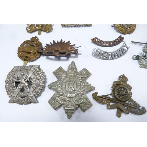 315 - Collection of assorted military cap badges and buttons, mainly Scottish regiments, also a collection... 