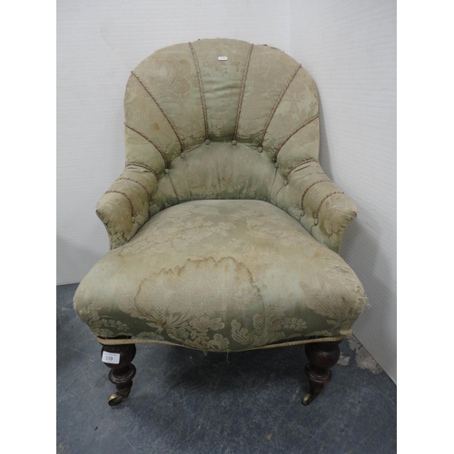 339 - Antique button-back armchair on brass castors.