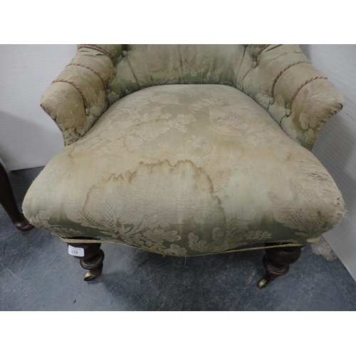 339 - Antique button-back armchair on brass castors.