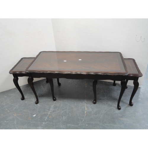 370 - Mahogany oval coffee table and a nest of three tables.