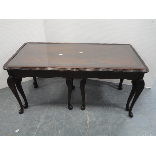 370 - Mahogany oval coffee table and a nest of three tables.