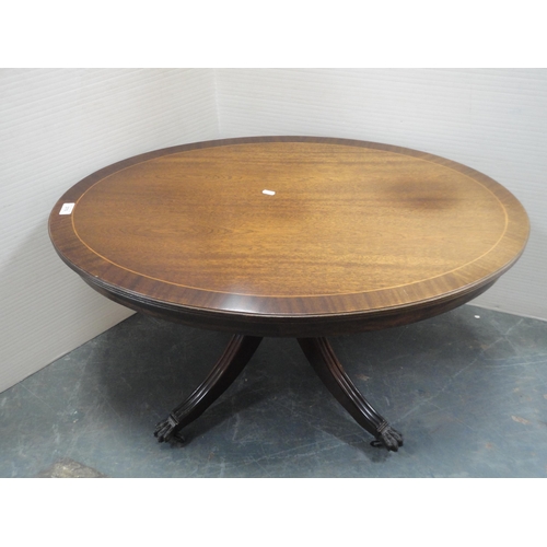 370 - Mahogany oval coffee table and a nest of three tables.