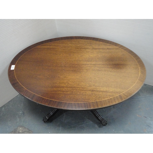 370 - Mahogany oval coffee table and a nest of three tables.