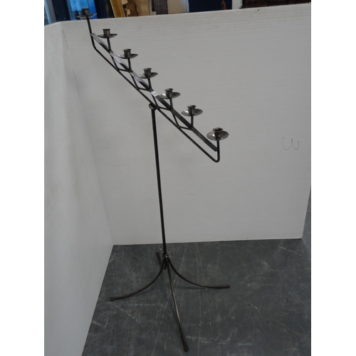 376 - Metal floor-standing candle holder.