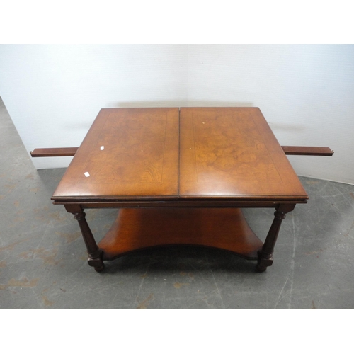 385 - Walnut extending coffee table with undertier.