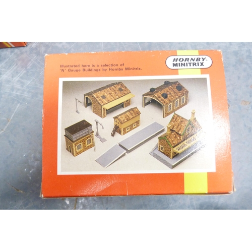 42 - Three cartons containing 00 gauge parts and accessories, rolling stock, tender, track, building acce... 