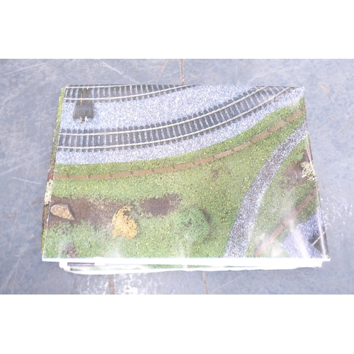 50 - Model railway accessories to include bridges, buildings, boxed Tri-ang 00 gauge R.126 stock car, box... 