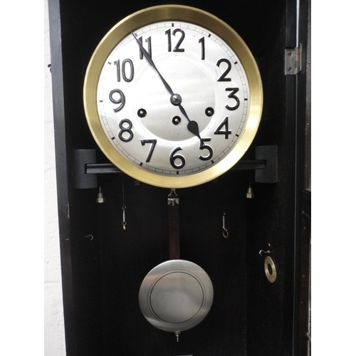 70 - Stained oak wall clock.