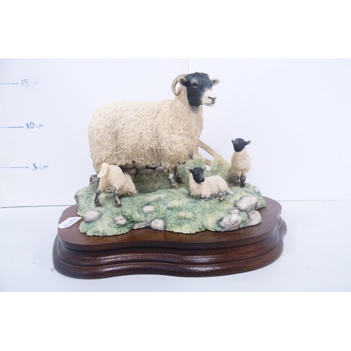 79 - Two Border Fine Arts groups to include dogs and sheep, both sculpted by Ray Ayres.  (2)